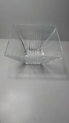 Sale Photo Thumbnail #278: The Tiffany & Co. Metropolis 8" Square Crystal Bowl is a discontinued luxury statement piece characterized by bold geometric lines and an Art Deco aesthetic. Introduced in 1999, this heavy, clear cut-crystal bowl serves as an elegant home decor centerpiec