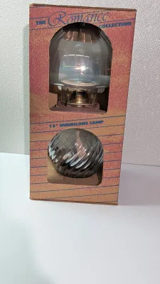 Sale Photo Thumbnail #468: Introducing a stunning addition to your vintage lamp collection - the Romance Collection 13" Glass Hurricane Oil Lamp. This exquisite piece comes in its original packaging and has never been used. Crafted from high-quality glass and finished with an oiled