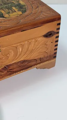 Sale Photo Thumbnail #435: The cedar box with the flower design has a broken latch

Vintage hand-carved cedar jewelry boxes featuring dovetail joints are highly sought-after mid-century collectibles, valued for their aromatic qualities, durability, and distinct folk-art aesthetic. 