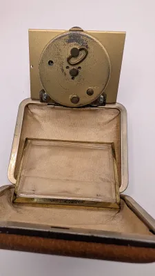 Sale Photo Thumbnail #403: Clocks are untested - The Elgin face cover has come off

Bradley and Elgin are classic mid-20th-century folding travel and desk alarm clocks manufactured in (West) Germany, typically featuring mechanical wind-up, 1-jewel movements. Often utilized by vario