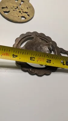 Sale Photo Thumbnail #322: Horse brass bridal medallions (or "horse brasses") are decorative, solid-brass plaques originally used to embellish the bridles and harnesses of working and parade horses. Originating in England in the mid-19th century, carters and farmers first used them