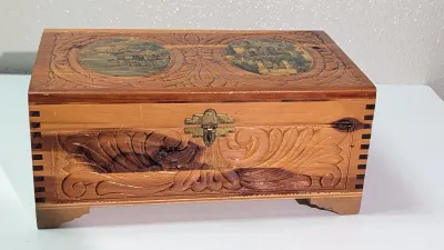 Sale Photo Thumbnail #431: The cedar box with the flower design has a broken latch

Vintage hand-carved cedar jewelry boxes featuring dovetail joints are highly sought-after mid-century collectibles, valued for their aromatic qualities, durability, and distinct folk-art aesthetic. 