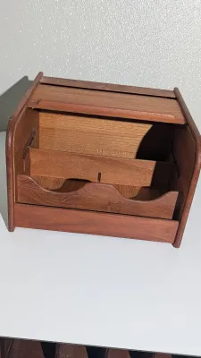Sale Photo Thumbnail #412: Vintage Mid-Century Modern (MCM) Danish Modern Teak Tambour Roll-Top Box Organizers are highly sought-after collectible pieces designed for both stylish desktop organization and vintage media storage. These functional pieces feature rich solid teak wood g