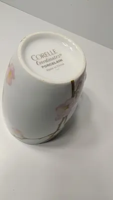 Sale Photo Thumbnail #327: Corelle Cherry Blossom Mugs are a popular discontinued dinnerware line prized for their elegant square silhouette and delicate pink and white floral motif. Unlike Corelle's signature Vitrelle glass plates, these coordinating mugs are crafted from durable,
