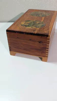 Sale Photo Thumbnail #437: The cedar box with the flower design has a broken latch

Vintage hand-carved cedar jewelry boxes featuring dovetail joints are highly sought-after mid-century collectibles, valued for their aromatic qualities, durability, and distinct folk-art aesthetic. 