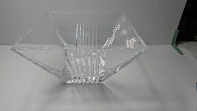 Sale Photo Thumbnail #277: The Tiffany & Co. Metropolis 8" Square Crystal Bowl is a discontinued luxury statement piece characterized by bold geometric lines and an Art Deco aesthetic. Introduced in 1999, this heavy, clear cut-crystal bowl serves as an elegant home decor centerpiec