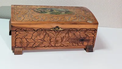 Sale Photo Thumbnail #442: The cedar box with the flower design has a broken latch

Vintage hand-carved cedar jewelry boxes featuring dovetail joints are highly sought-after mid-century collectibles, valued for their aromatic qualities, durability, and distinct folk-art aesthetic. 