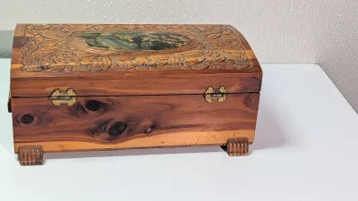 Sale Photo Thumbnail #444: The cedar box with the flower design has a broken latch

Vintage hand-carved cedar jewelry boxes featuring dovetail joints are highly sought-after mid-century collectibles, valued for their aromatic qualities, durability, and distinct folk-art aesthetic. 
