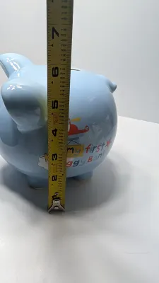 Sale Photo Thumbnail #233: The floral bank is missing the cover on the bottom

Piggy banks are excellent tools for teaching financial responsibility, organizing loose change, or adding a decorative accent to a room. Whether you are looking for a classic keepsake nursery decoration 