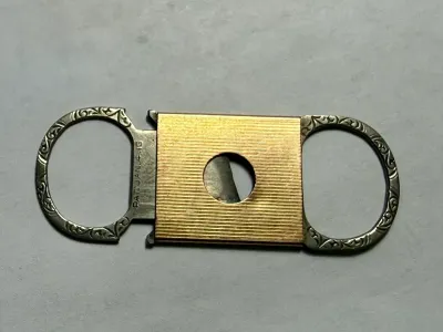 ENGRAVED ART DECO ERA STERLING & 14K SOLID GOLD CIGAR CUTTER PREOWNED FROM AN ESTATE USED AS PICTURED.