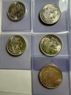 (7) NICE UNCICULATED CONDITION 1921-P MORGAN SILVER DOLLARS AS PICTURED.