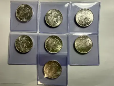 (7) NICE UNCICULATED CONDITION 1921-P MORGAN SILVER DOLLARS AS PICTURED.