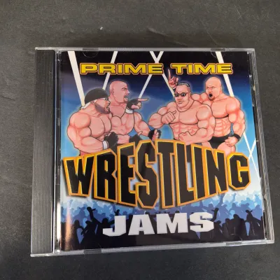 LOT 32B: WWF CD Collection with Mick Foley's Christmas Chaos Book & Bret Hitman Hart Book