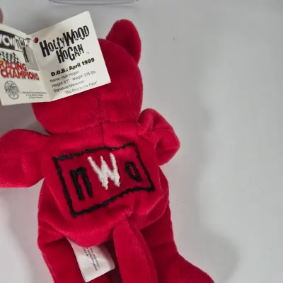 LOT 194Z: WWF Hollywood Hulk Hogan & Stone Cold Steve Austin Collection with Autographed T-shirt by HHH & Steve Austin