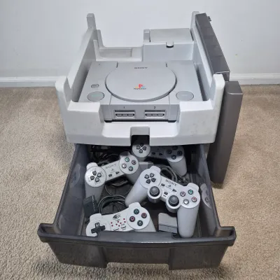LOT 199Z: Sony Play Station Console, 4 Controllers, Memory Cards in Rolling Storage Cart