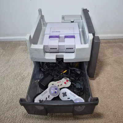 LOT 198Z: Super Nintendo Console & Controllers in Rolling Storage Cart