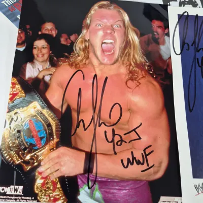 LOT 191Z: Vintage WWF Collection-Chris Jericho Autographs, Raw Magazines, Big Show Action Figure & More