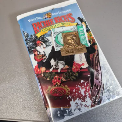 LOT 27B: Vintage VHS Clamshell Collection with Sealed "The Goonies" Movie