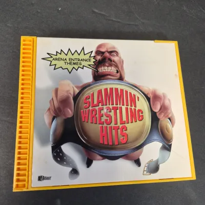 LOT 32B: WWF CD Collection with Mick Foley's Christmas Chaos Book & Bret Hitman Hart Book