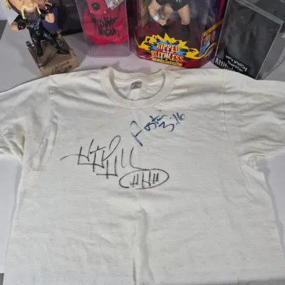 LOT 194Z: WWF Hollywood Hulk Hogan & Stone Cold Steve Austin Collection with Autographed T-shirt by HHH & Steve Austin