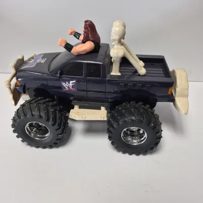 LOT 47B: Vintage WWF Titan Tron Entrance Stage & Talking/Action Monster Trucks with Undertaker, Stone Cold & Legion of Doom