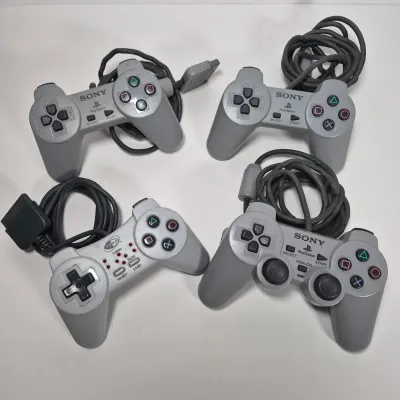 LOT 199Z: Sony Play Station Console, 4 Controllers, Memory Cards in Rolling Storage Cart