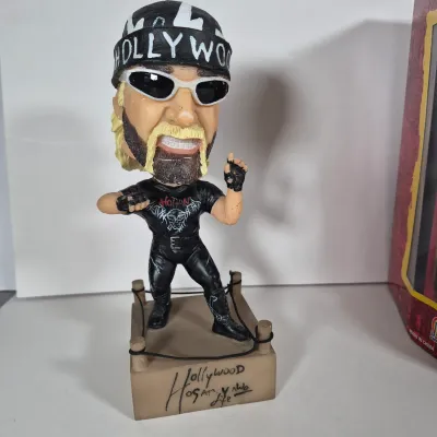 LOT 194Z: WWF Hollywood Hulk Hogan & Stone Cold Steve Austin Collection with Autographed T-shirt by HHH & Steve Austin