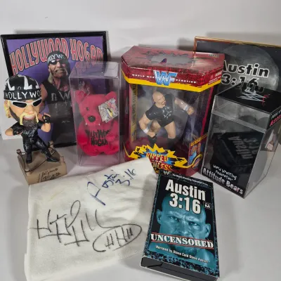 LOT 194Z: WWF Hollywood Hulk Hogan & Stone Cold Steve Austin Collection with Autographed T-shirt by HHH & Steve Austin