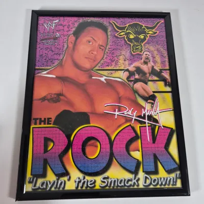 LOT 192Z: Stone Cold & The Rock Autographed Plaques, 1999 WWF WrestleMania T-Shirt & More