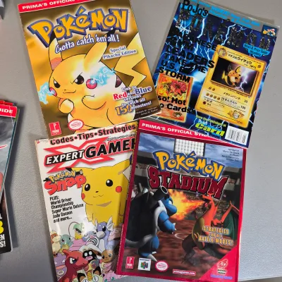 LOT 34B: Collection of Gaming Magazines-Pokémon, Prima's Official Strategy Guide, Game Informer & More