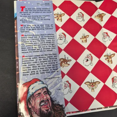 LOT 32B: WWF CD Collection with Mick Foley's Christmas Chaos Book & Bret Hitman Hart Book