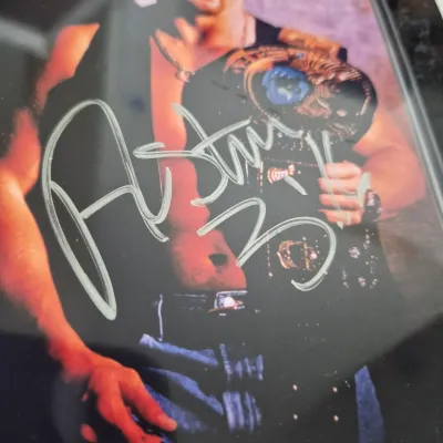 LOT 192Z: Stone Cold & The Rock Autographed Plaques, 1999 WWF WrestleMania T-Shirt & More