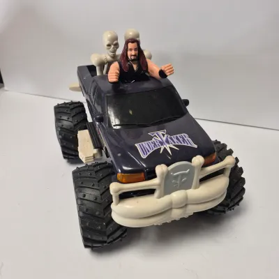 LOT 47B: Vintage WWF Titan Tron Entrance Stage & Talking/Action Monster Trucks with Undertaker, Stone Cold & Legion of Doom