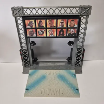 LOT 47B: Vintage WWF Titan Tron Entrance Stage & Talking/Action Monster Trucks with Undertaker, Stone Cold & Legion of Doom