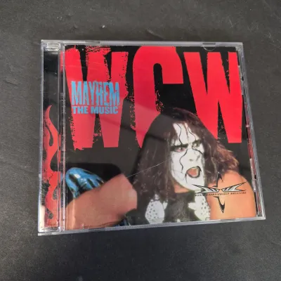 LOT 32B: WWF CD Collection with Mick Foley's Christmas Chaos Book & Bret Hitman Hart Book