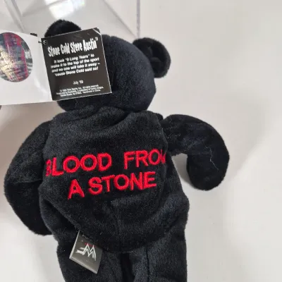 LOT 194Z: WWF Hollywood Hulk Hogan & Stone Cold Steve Austin Collection with Autographed T-shirt by HHH & Steve Austin