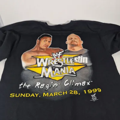 LOT 192Z: Stone Cold & The Rock Autographed Plaques, 1999 WWF WrestleMania T-Shirt & More