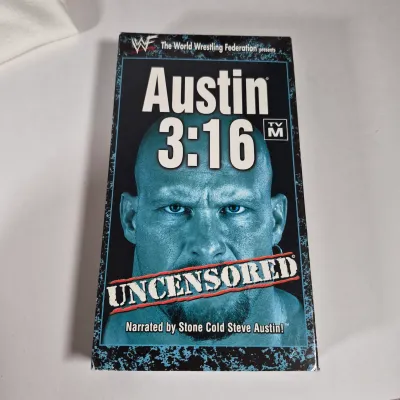 LOT 194Z: WWF Hollywood Hulk Hogan & Stone Cold Steve Austin Collection with Autographed T-shirt by HHH & Steve Austin