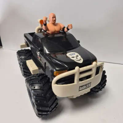 LOT 47B: Vintage WWF Titan Tron Entrance Stage & Talking/Action Monster Trucks with Undertaker, Stone Cold & Legion of Doom