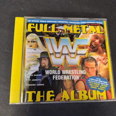 LOT 32B: WWF CD Collection with Mick Foley's Christmas Chaos Book & Bret Hitman Hart Book
