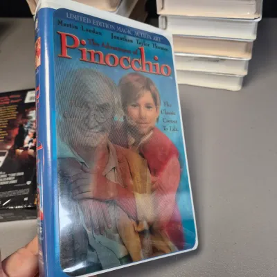 LOT 27B: Vintage VHS Clamshell Collection with Sealed "The Goonies" Movie