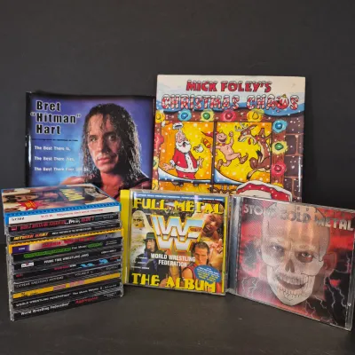 LOT 32B: WWF CD Collection with Mick Foley's Christmas Chaos Book & Bret Hitman Hart Book