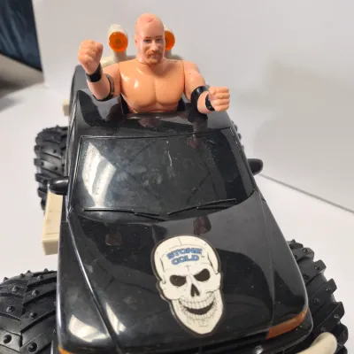 LOT 47B: Vintage WWF Titan Tron Entrance Stage & Talking/Action Monster Trucks with Undertaker, Stone Cold & Legion of Doom