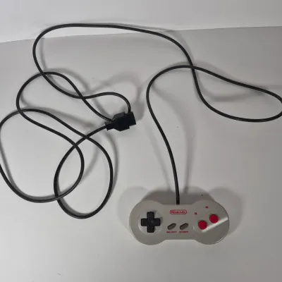 LOT 198Z: Super Nintendo Console & Controllers in Rolling Storage Cart