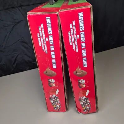 LOT 45B: (2) New in Package NFL Mighty Helmet Racers