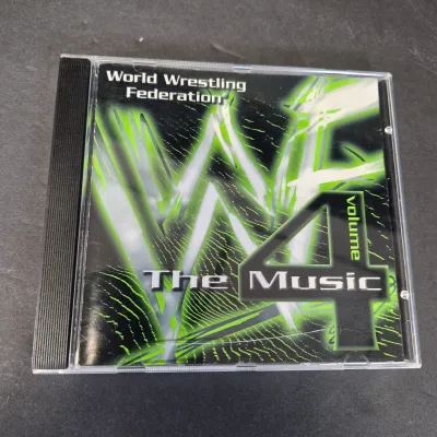 LOT 32B: WWF CD Collection with Mick Foley's Christmas Chaos Book & Bret Hitman Hart Book