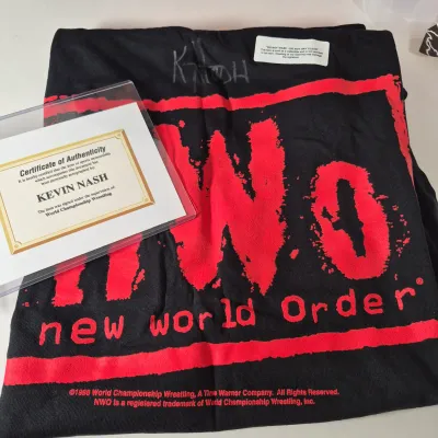 LOT 190Z: WWF Kevin Nash/NWO Collection with Signed Unworn T-shirt with COA