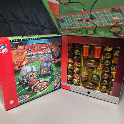 LOT 45B: (2) New in Package NFL Mighty Helmet Racers