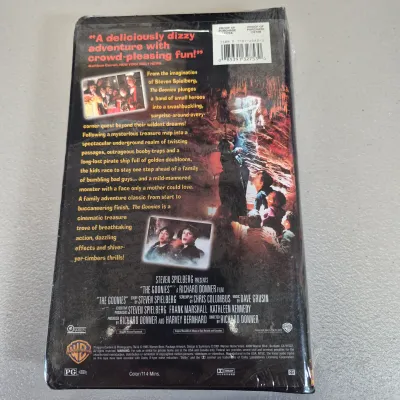 LOT 27B: Vintage VHS Clamshell Collection with Sealed "The Goonies" Movie