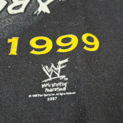 LOT 192Z: Stone Cold & The Rock Autographed Plaques, 1999 WWF WrestleMania T-Shirt & More